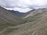 Tibet Kailash 09 Kora 13 Akshobhya Eastern Valley The friendly valley of the eastern Dhyani-Buddha, Aksobhya, welcomes the pilgrim with lovely green camping grounds and silvery streams of crystal-clear water. � Lama Anagarika Govinda: The Way of the White Clouds.